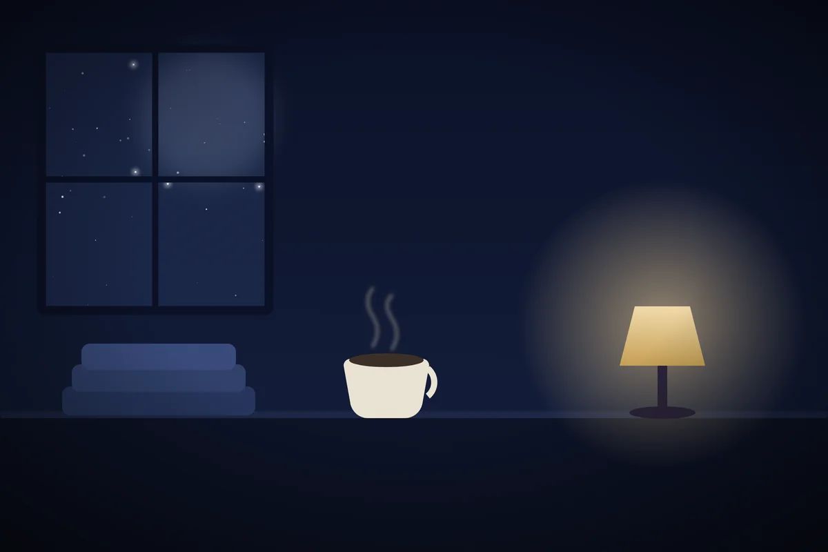 A cup of herbal tea, a folded blanket and a small lamp beside a window at night.